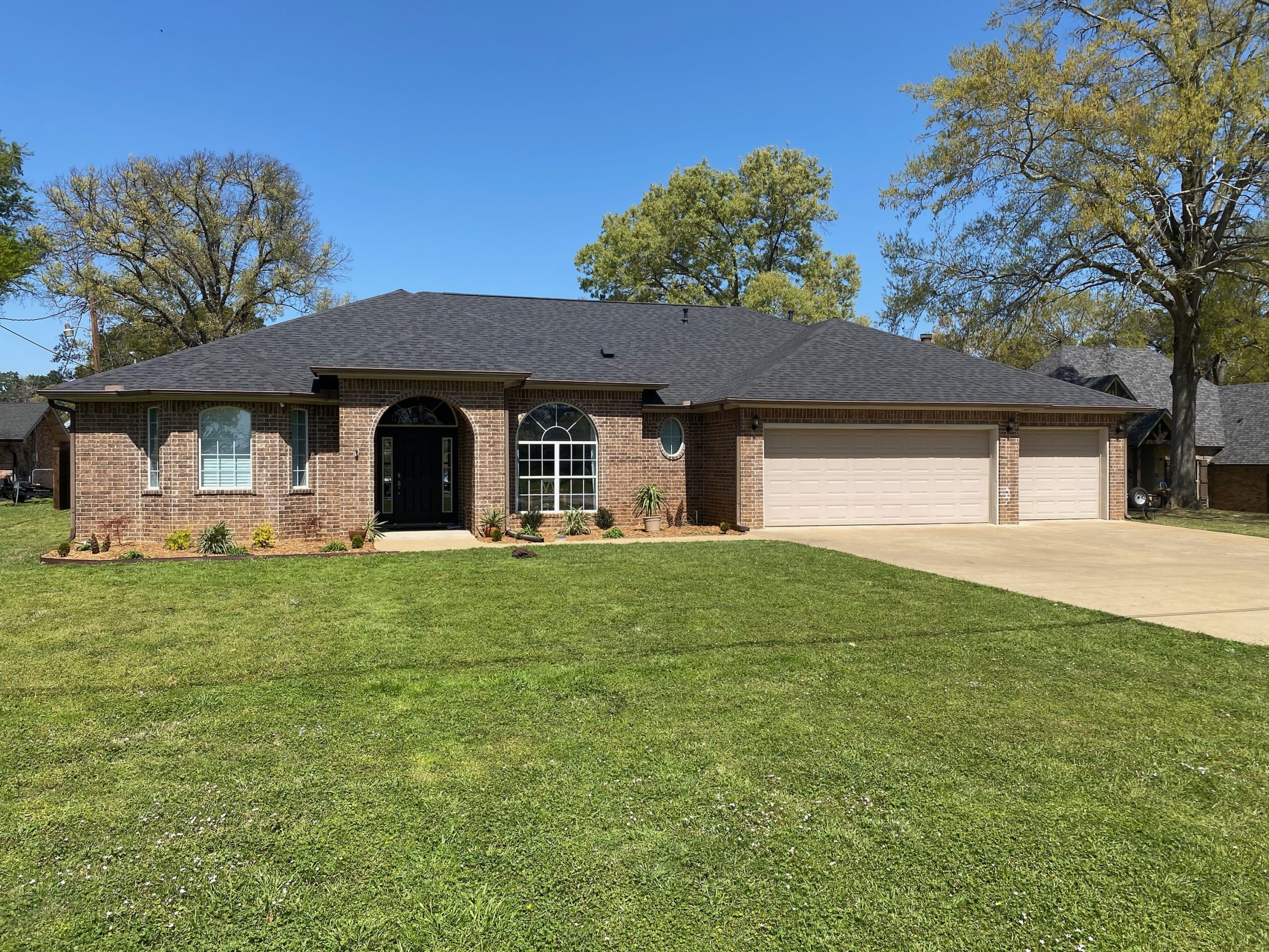Large brick estate home with three-car garage and new charcoal shingle roof, Tyler TX