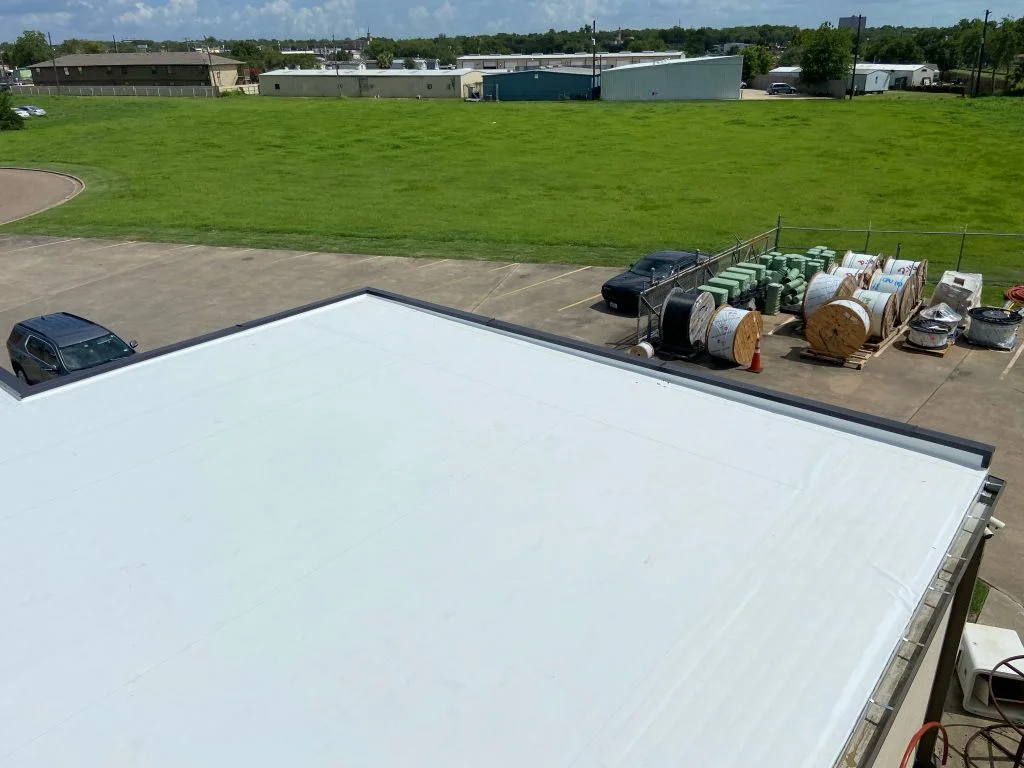 Commercial flat roof installation on a low-slope building in Tyler, Texas by Redline Roofing