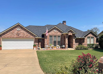 Craftsman-style home with new charcoal shingle roof installation near Tyler, TX