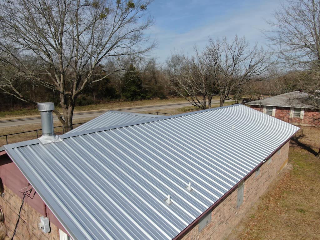 Metal Roofing Repair in Tyler, TX - Brown Building With Silver Metal Roof